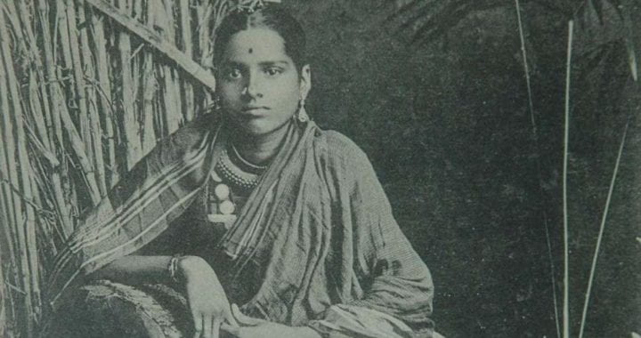 Black and white photo from theGomantak Maratha Samaj Archives, Mumbai of a seated person wearing Indian clothing